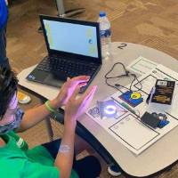 A student works on an electronics project